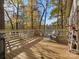 Spacious deck featuring patio furniture and treeline views with fall foliage at 294 Carroll Cv, Clover, SC 29710