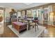 Spacious dining area illuminated by natural light, showcases a wooden table, upholstered chairs, and storage furnishings at 294 Carroll Cv, Clover, SC 29710