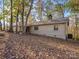 Exterior of home showcasing natural wood tones with lots of surrounding trees at 294 Carroll Cv, Clover, SC 29710