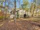 Exterior shot showcases a quaint home with an elevated deck, nestled among autumn trees at 294 Carroll Cv, Clover, SC 29710