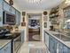 Well-equipped kitchen with stainless steel appliances, blue cabinets, and an open view to the living room at 294 Carroll Cv, Clover, SC 29710