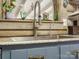 Close up on a stainless steel sink with a gooseneck faucet, a window and wood accents in the background at 294 Carroll Cv, Clover, SC 29710