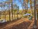 Picturesque lake view featuring waterfront seating beneath a shady canopy, enhancing the tranquil outdoor experience at 294 Carroll Cv, Clover, SC 29710