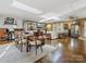 Spacious open-concept living and dining area with wood floors, natural light, and stylish furnishings at 294 Carroll Cv, Clover, SC 29710