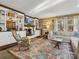 Living room featuring built-in shelving, fireplace, TV, a sofa, and hardwood floors with area rug at 294 Carroll Cv, Clover, SC 29710