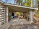 Covered outdoor dining area features rustic decor and ample space for entertaining guests at 294 Carroll Cv, Clover, SC 29710