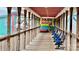 Papa Doc's exterior is a long, covered, wooden deck with railings and lots of blue seats at 294 Carroll Cv, Clover, SC 29710