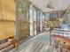 Bright sunroom with screen windows providing scenic outdoor views, furnished with cozy seating and natural light at 294 Carroll Cv, Clover, SC 29710