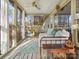 Cozy sunroom with ample natural light, comfortable seating, and views of the surrounding landscape at 294 Carroll Cv, Clover, SC 29710