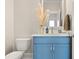 Powder room with blue vanity and quartz countertop at 1094 Herrons Ferry Rd, Rock Hill, SC 29730