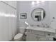 Bright bathroom with a round mirror, granite vanity, toilet, and a shower with a curtain at 12023 Huntson Reserve Rd, Huntersville, NC 28078