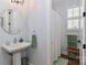 Traditional bathroom featuring a pedestal sink, a framed mirror, and a shower with a white curtain at 12023 Huntson Reserve Rd, Huntersville, NC 28078