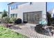 Covered patio with brick flooring, comfortable seating, and easy access to the backyard and outdoor grill at 12023 Huntson Reserve Rd, Huntersville, NC 28078