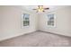 Spacious bedroom with neutral carpeting and large windows at 1235 10Th Ne St, Hickory, NC 28601