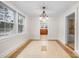 Dining area with tile floors and chandelier, open to kitchen at 1235 10Th Ne St, Hickory, NC 28601