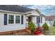 House exterior with a front porch, red steps, and landscaping at 1235 10Th Ne St, Hickory, NC 28601