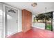 Inviting front porch with a brick column and a white porch swing at 1235 10Th Ne St, Hickory, NC 28601