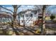 Rear view of a house, highlighting its exterior features and landscaping at 1235 10Th Ne St, Hickory, NC 28601