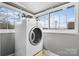 Laundry area with a dryer and large windows at 1235 10Th Ne St, Hickory, NC 28601