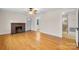 Living room with hardwood floors, fireplace, and access to bathroom at 1235 10Th Ne St, Hickory, NC 28601