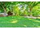 Lush backyard with mature trees offering plenty of shade and space for recreation and activities at 2005 Robyn Ave, Shelby, NC 28152