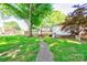 The backyard features a lush lawn, mature trees and patio at 2005 Robyn Ave, Shelby, NC 28152
