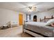 Bright bedroom includes a queen-sized bed, baby furniture, and staircase access, bathed in natural light at 2005 Robyn Ave, Shelby, NC 28152