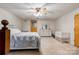 Spacious bedroom with a queen-sized bed, neutral decor, white furniture, and a ceiling fan at 2005 Robyn Ave, Shelby, NC 28152