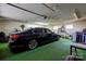 View of car parked in garage with painted floors and overhead storage space at 2005 Robyn Ave, Shelby, NC 28152