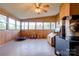 Wood-paneled sunroom has a wood burning stove at 2005 Robyn Ave, Shelby, NC 28152