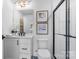 Stylish bathroom featuring a glass shower enclosure, modern vanity, and decorative wall art at 2146 Barrowcliffe Nw Dr, Concord, NC 28027