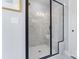 Contemporary bathroom showcasing a walk-in shower with marble-style tile and a sleek black frame at 2146 Barrowcliffe Nw Dr, Concord, NC 28027