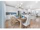 Bright open-concept dining room featuring modern lighting, light wood floors, and seating for six at 2146 Barrowcliffe Nw Dr, Concord, NC 28027