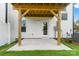 View of the covered patio with concrete flooring and white columns at 2146 Barrowcliffe Nw Dr, Concord, NC 28027