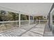 White porch with wooden floor and backyard view at 2403 Mary Ave, Gastonia, NC 28052