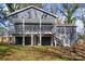 Gray house with white trim, deck, and stairs leading to backyard at 2403 Mary Ave, Gastonia, NC 28052