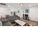 Living room with gray couches and view into kitchen at 2403 Mary Ave, Gastonia, NC 28052