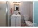 Clean bathroom with a white vanity, toilet, and shower at 2701 Palm Ave, Charlotte, NC 28205