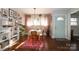 Bright dining area with hardwood floors and gallery wall at 2701 Palm Ave, Charlotte, NC 28205