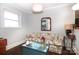 Sitting room with floral sofa and wood floors at 2701 Palm Ave, Charlotte, NC 28205