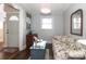 Cozy sitting room with floral sofa and wood floors at 2701 Palm Ave, Charlotte, NC 28205