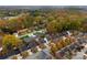 Aerial view of neighborhood with autumn trees and homes at 548 Summerfield Pl, Belmont, NC 28012