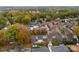 Aerial view of a neighborhood with houses in autumn colors at 548 Summerfield Pl, Belmont, NC 28012