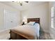 Bright bedroom with double doors and cozy bed at 548 Summerfield Pl, Belmont, NC 28012