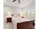 Comfortable bedroom with a double bed and wood nightstands at 548 Summerfield Pl, Belmont, NC 28012