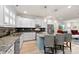 Spacious kitchen with white cabinets and granite island at 548 Summerfield Pl, Belmont, NC 28012