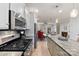 Modern kitchen features stainless steel appliances and granite countertops at 548 Summerfield Pl, Belmont, NC 28012