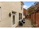 Brick patio with two chairs and exterior access at 548 Summerfield Pl, Belmont, NC 28012