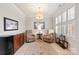 Bright sitting room with two armchairs and a world map print at 548 Summerfield Pl, Belmont, NC 28012