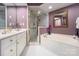 Spa-like bathroom with soaking tub, shower, and double vanity at 5635 Ballinard Ln, Charlotte, NC 28277